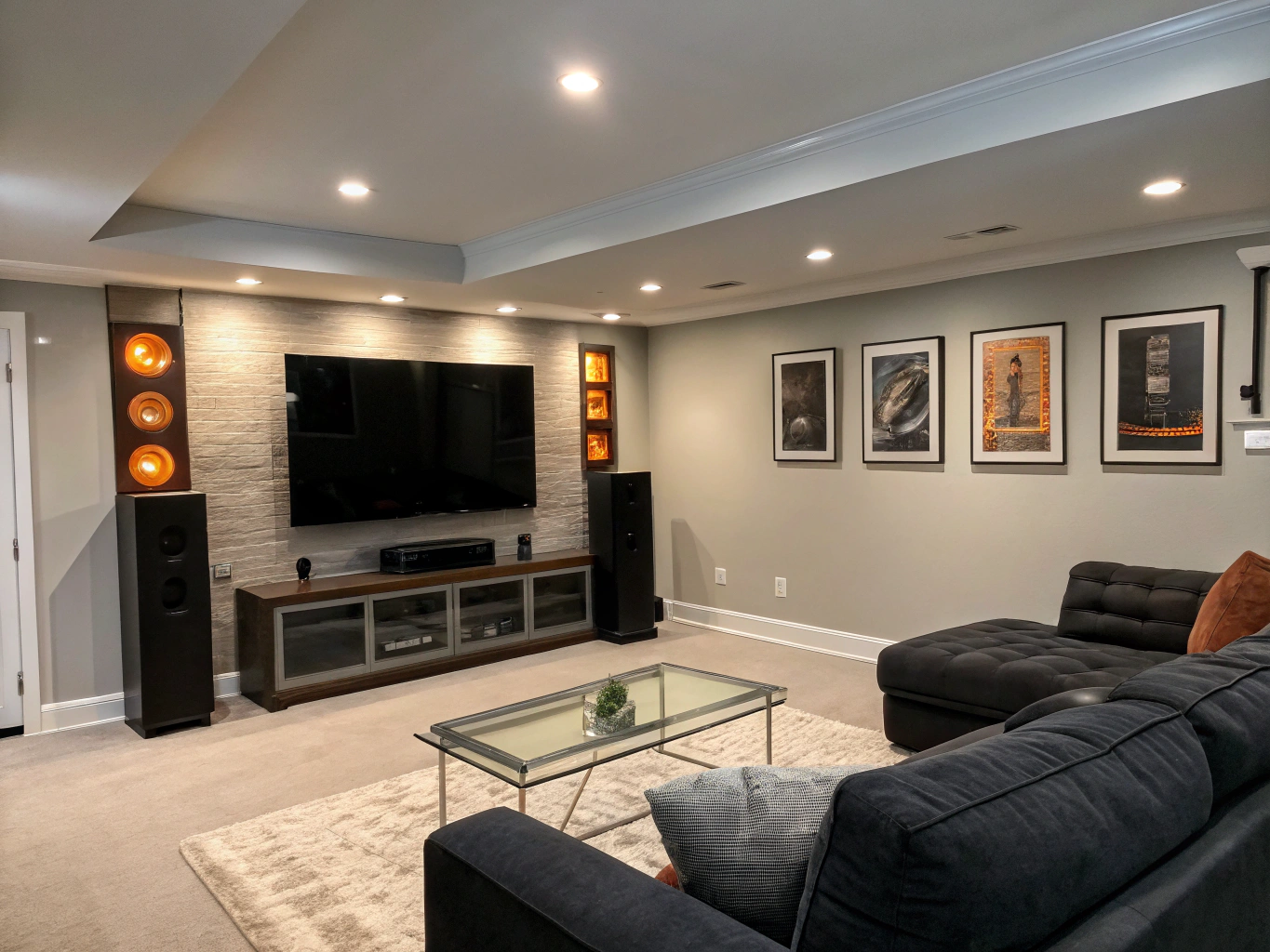 Finished entertainment room with charcoal trim and clean ceiling beams